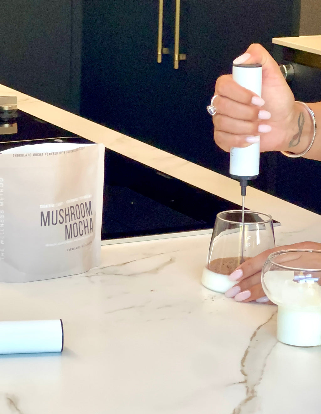 Mushroom Mocha Foundation pouch with measuring spoon and milk frother — the Ritual Tools included with a first Founding 50 delivery